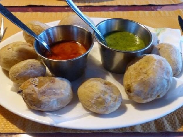 Wrinkled potatoes with green and red mojo sauce served in a guachinche in Tenerife